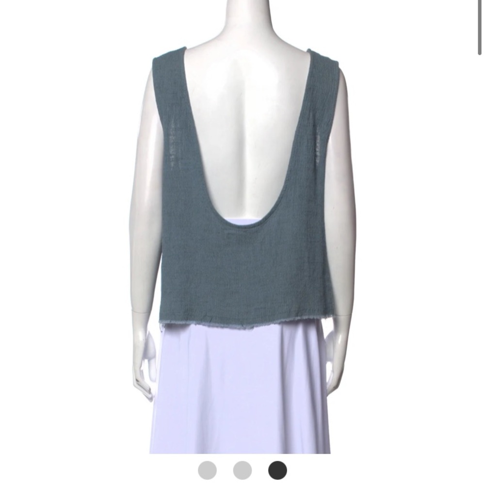 Scoop neck, low cut in the back shirt. Sz M but could fit a L as well